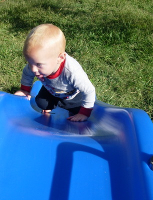 Matthias climbs up the slide